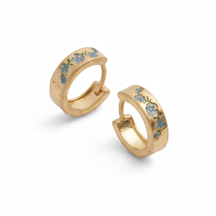 Fable forget-me-not gold hoop earrings, pair angled on white background