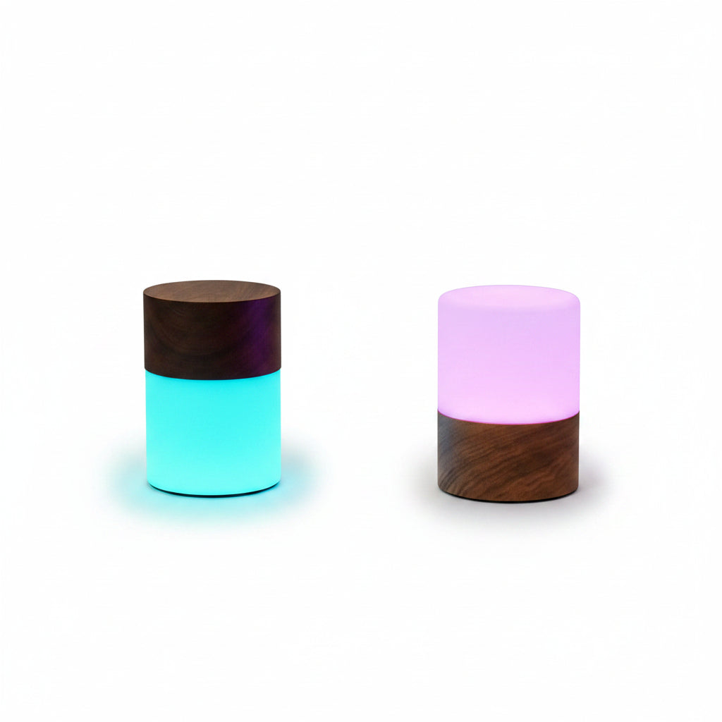 Two Lemelia lights on a wooden bath tray glowing blue and lilac
