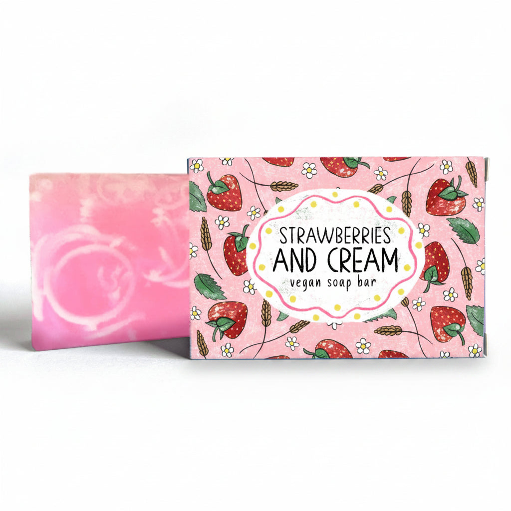 Strawberry and Cream vegan soap bar beside its illustrated box