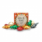 Illustrated box of bath oil pearls with metallic red, green and gold pearls