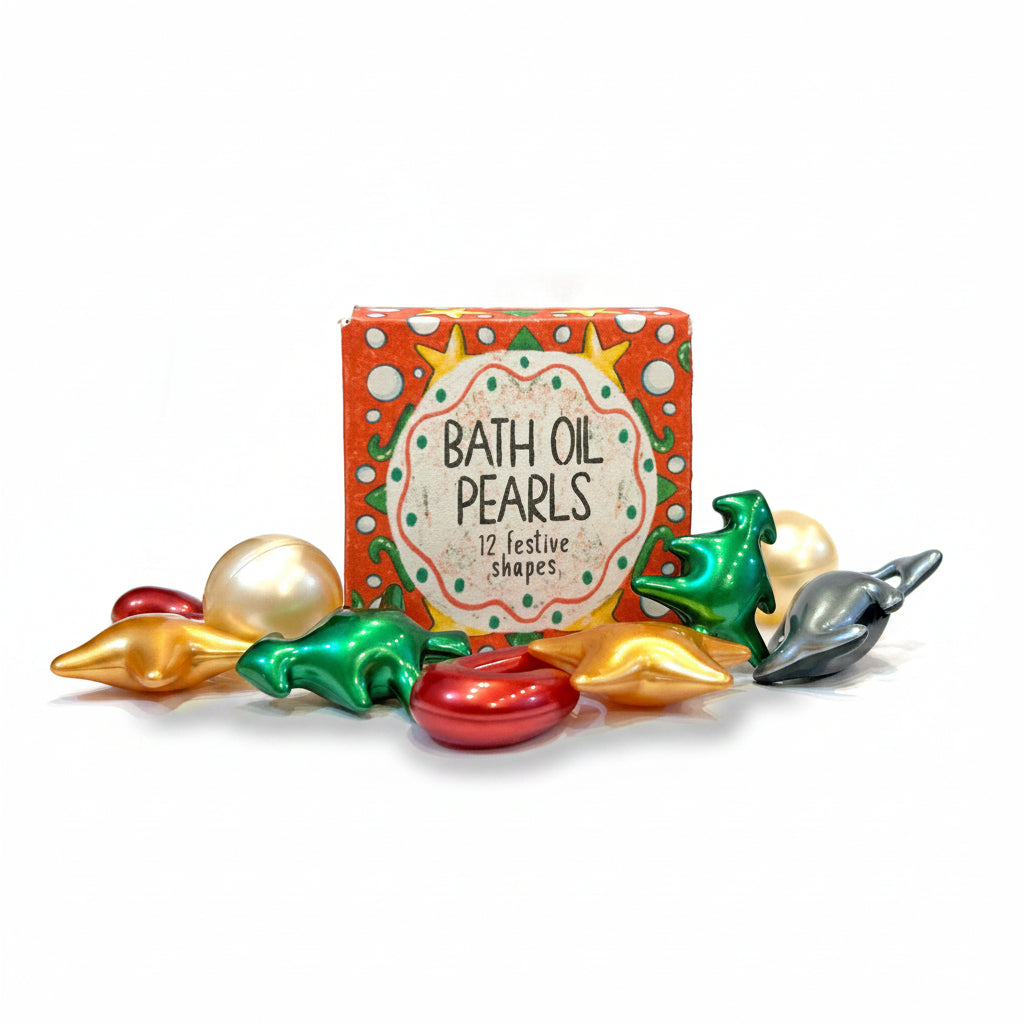Illustrated box of bath oil pearls with metallic red, green and gold pearls