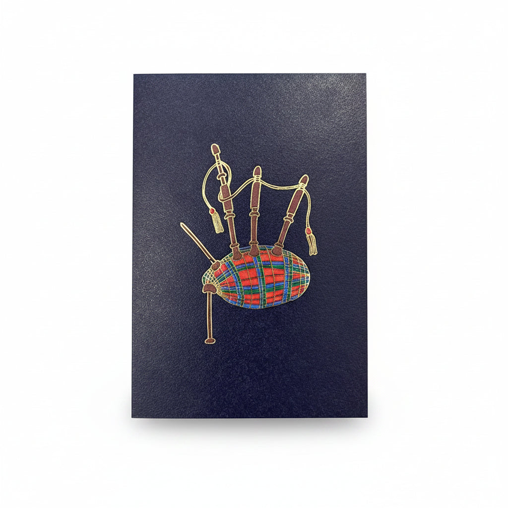 Gold foil bagpipes with a tartan bag on a deep navy greeting card