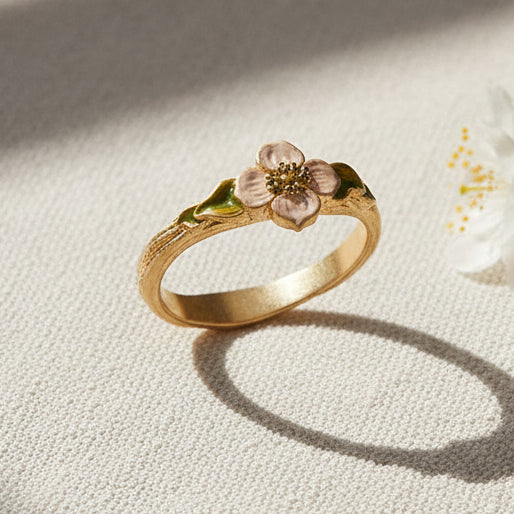 Poppy Anemone ring on textured linen catching the afternoon light