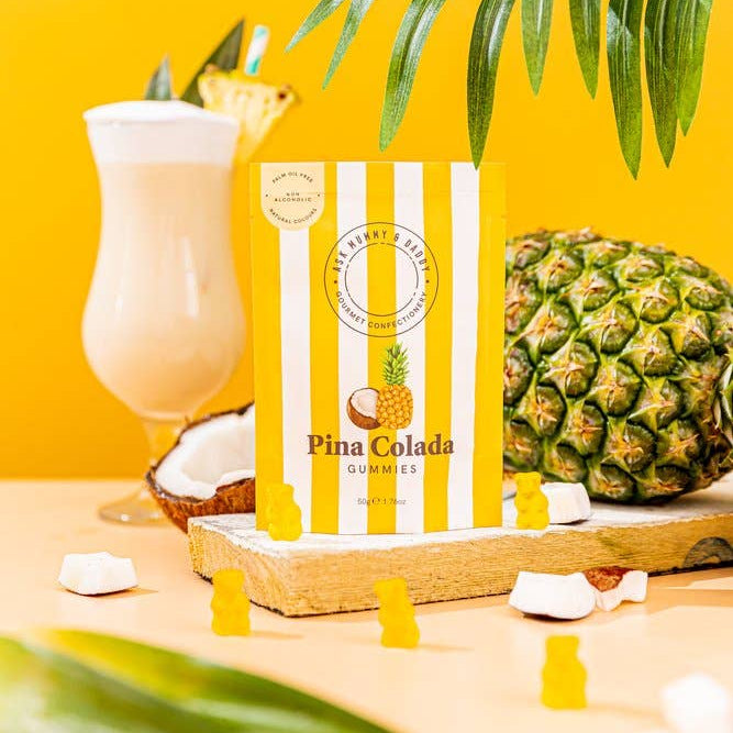 Pina Colada gummies pouch with a cocktail and pineapple on yellow