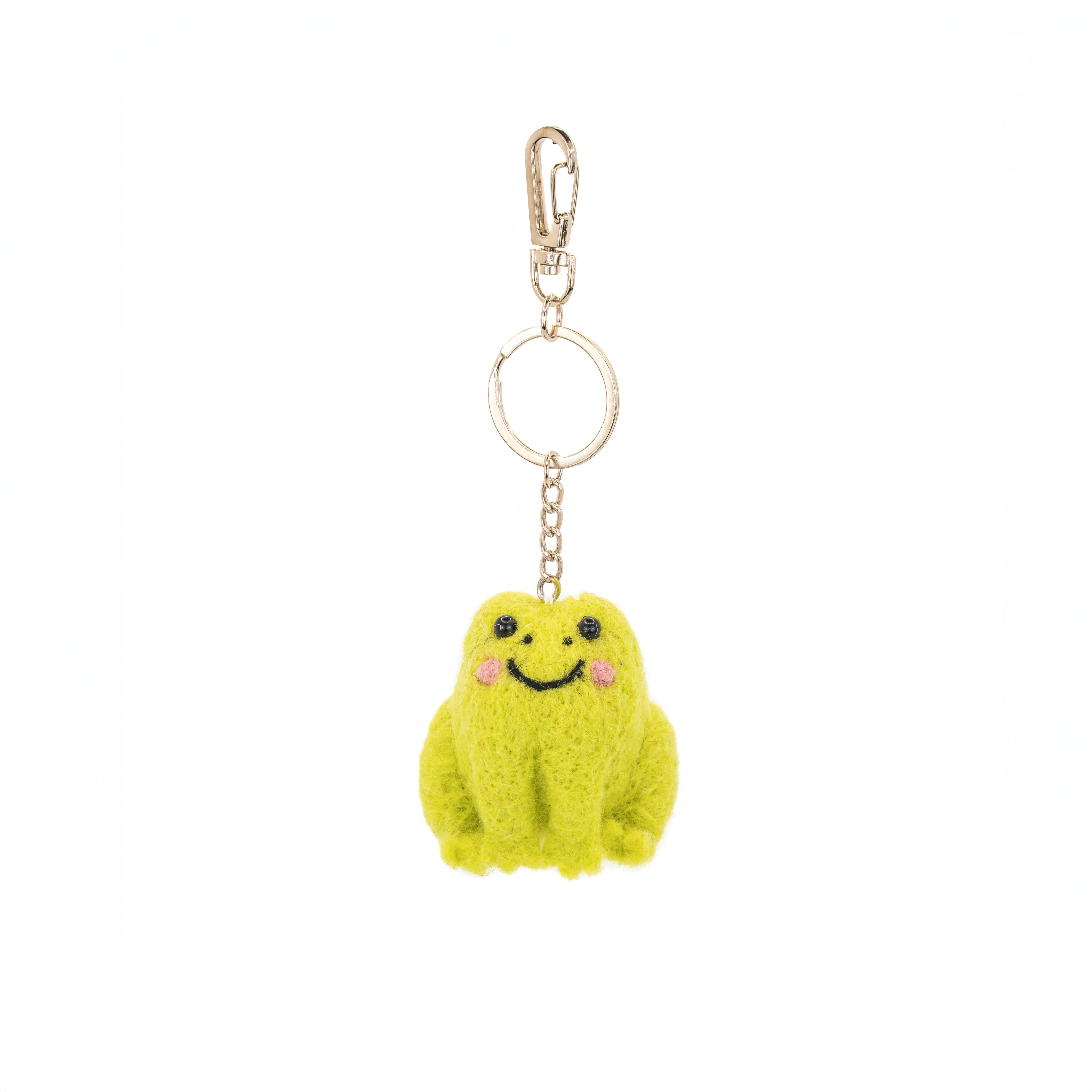Handcrafted frog keyring showing soft felt body and detailed stitching