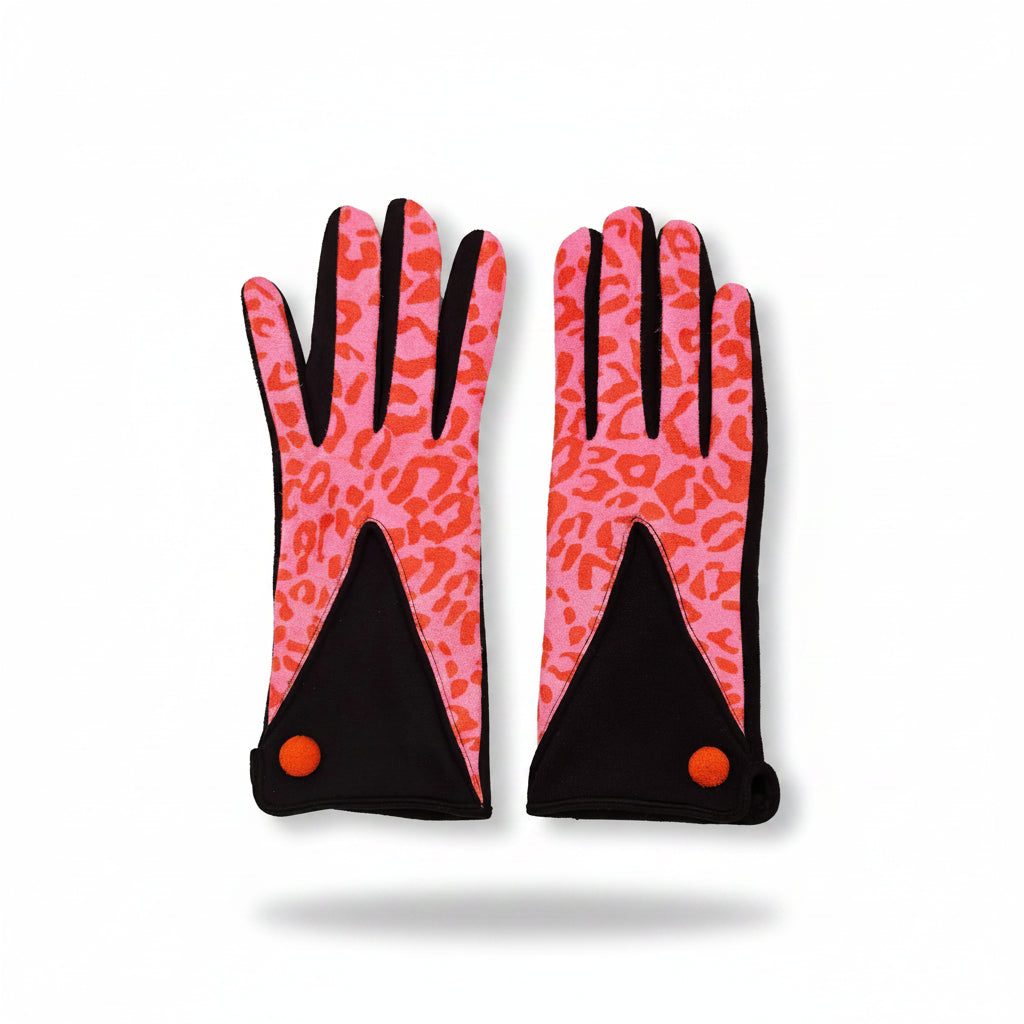 Flat lay of animal print pink and black gloves with orange button detail, bold leopard pattern on front.