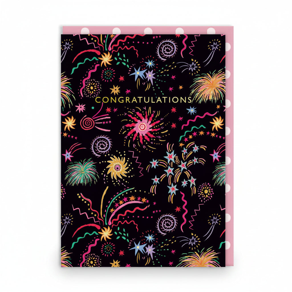 Black congratulations card covered in colourful hand-drawn fireworks and gold lettering
