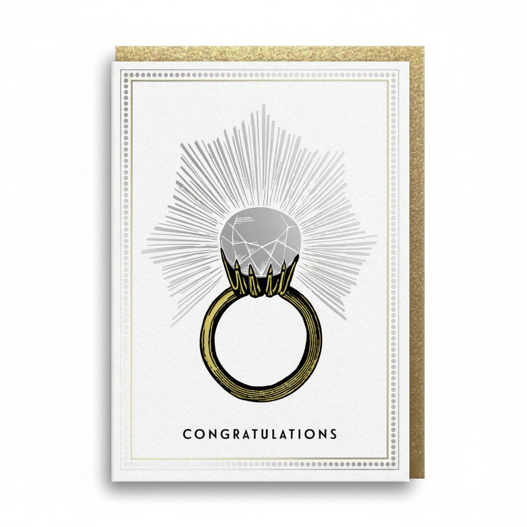 Cream engagement card with a gold foil ring and a silver foil diamond