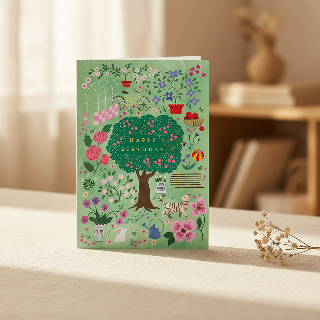 Greeting card with garden-themed illustration and 'Happy Birthday' text on a green background