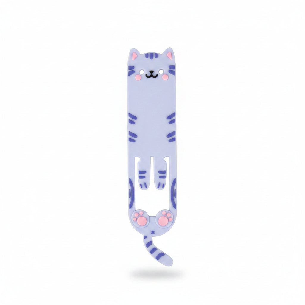 Flexible cat-shaped reading light clipped to an open book, showing its bookmark functionality and cute paw design on a wooden surface with books nearby.