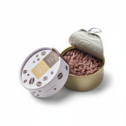 Opened Coffee CandleCan tin showing ultra-realistic wax coffee beans and twin wicks inside a golden can, with matching packaging beside it.
