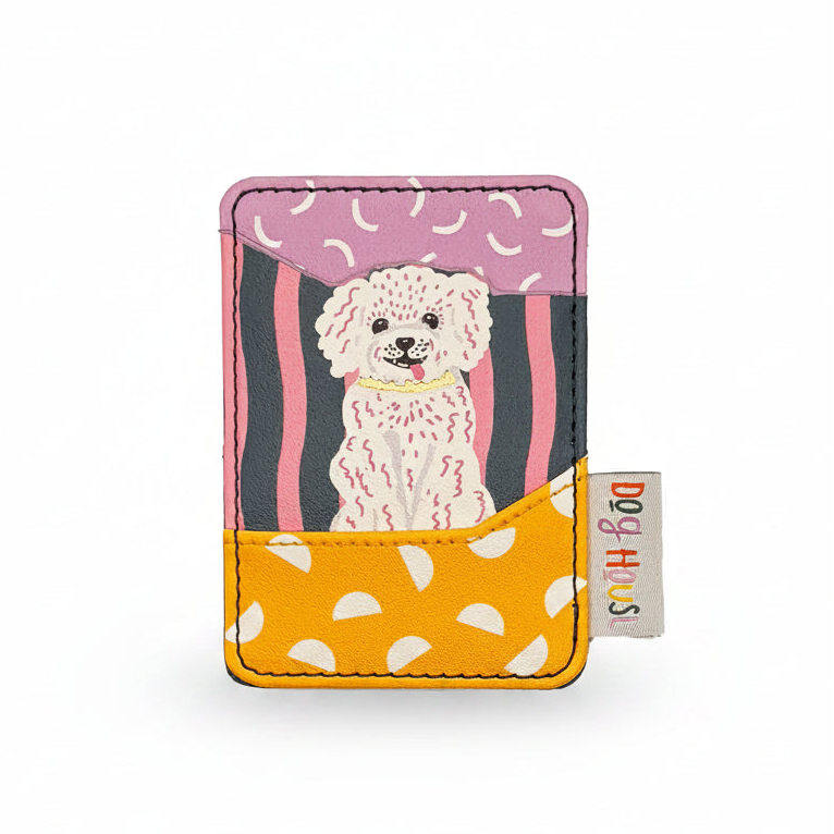 Flat lay of Dog House Dog Card Holder with illustrated dog and yellow polka dot pocket.