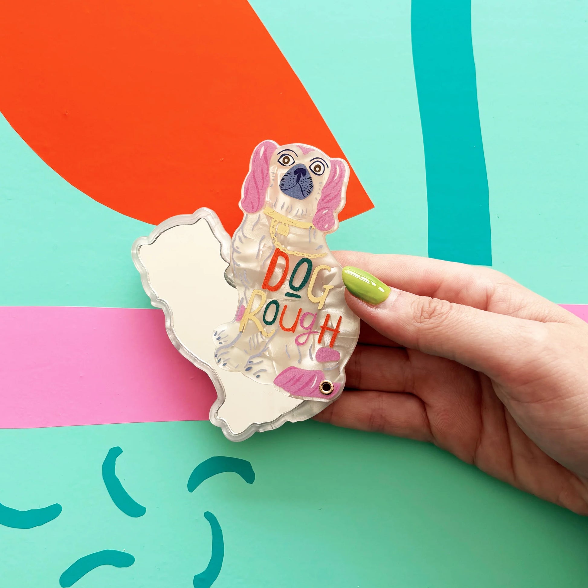 Dog House Dog Rough Compact Mirror by House of Disaster with spaniel design and “Dog Rough” text on colourful background.