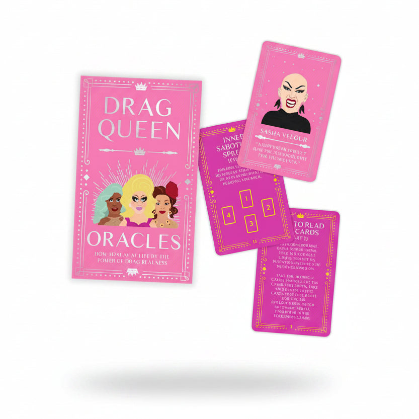 Drag Queen Oracles pink box and cards on marble background.