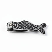 Black and silver fish shaped nail clippers close-up.
