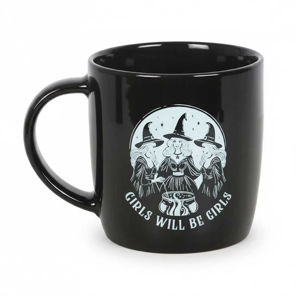 Front view of gothic black mug featuring three witches and text ‘Girls Will Be Girls’.