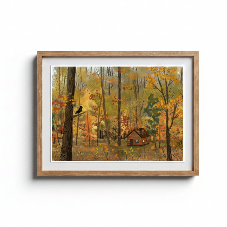 A framed art print depicting an autumn forest scene with a small cabin, tall trees, and a bird perched on a trunk, shown against a light gray wall.