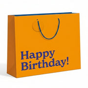 Orange birthday gift bag with 'Happy Birthday!' text on a white background