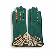 Flat lay of zebra print gloves with forest green fabric and colourful button accents on cuffs.