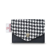 Black and white dogtooth Harris Tweed card holder with black trim on white background