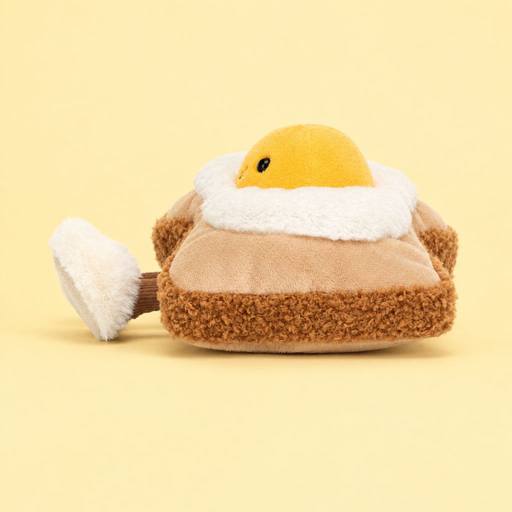 Side view of Jellycat Amuseables Egglantine Egg on Toast highlighting the plush layers and soft textures.