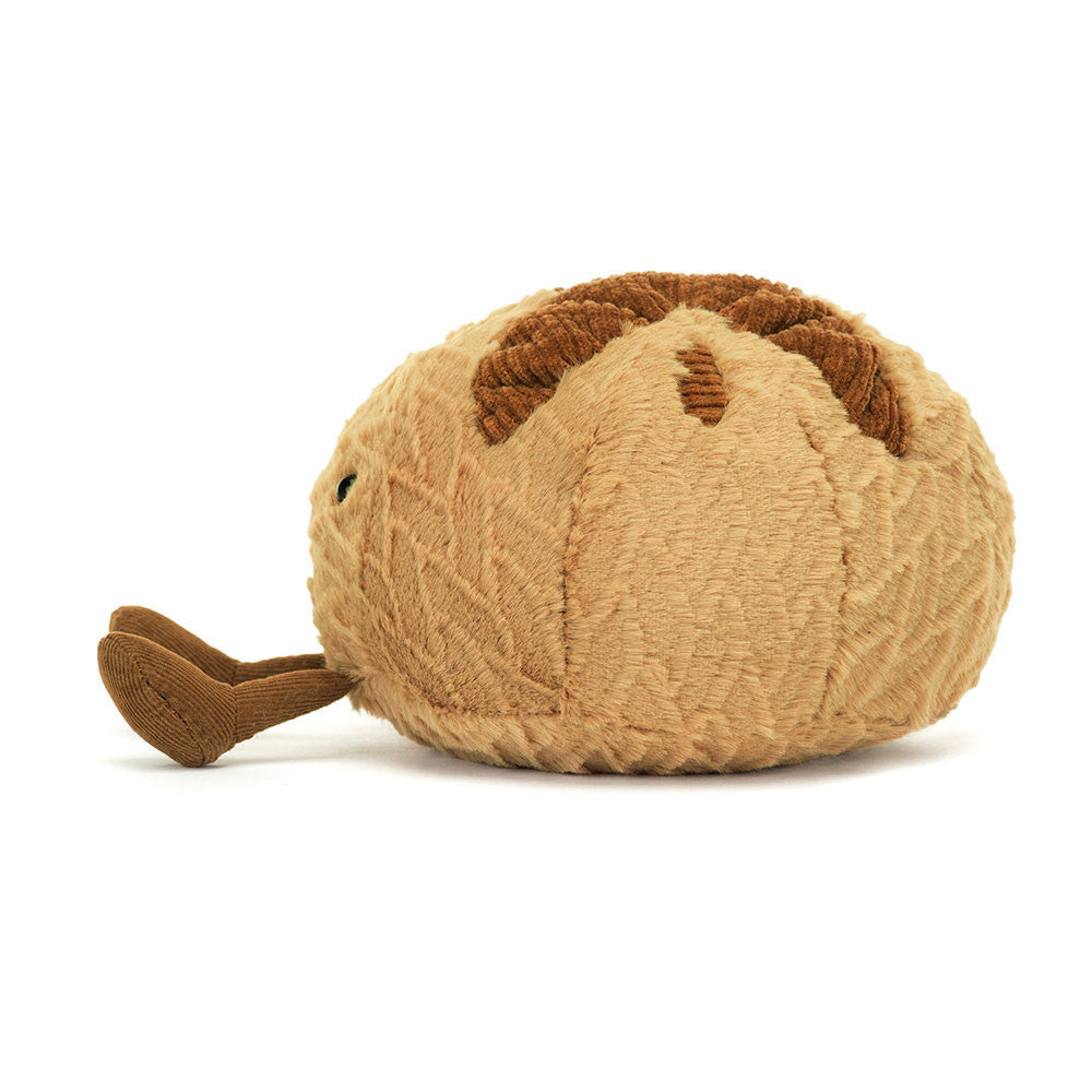 Side profile of soft Jellycat Sourdough plush with crusty stitched detail.