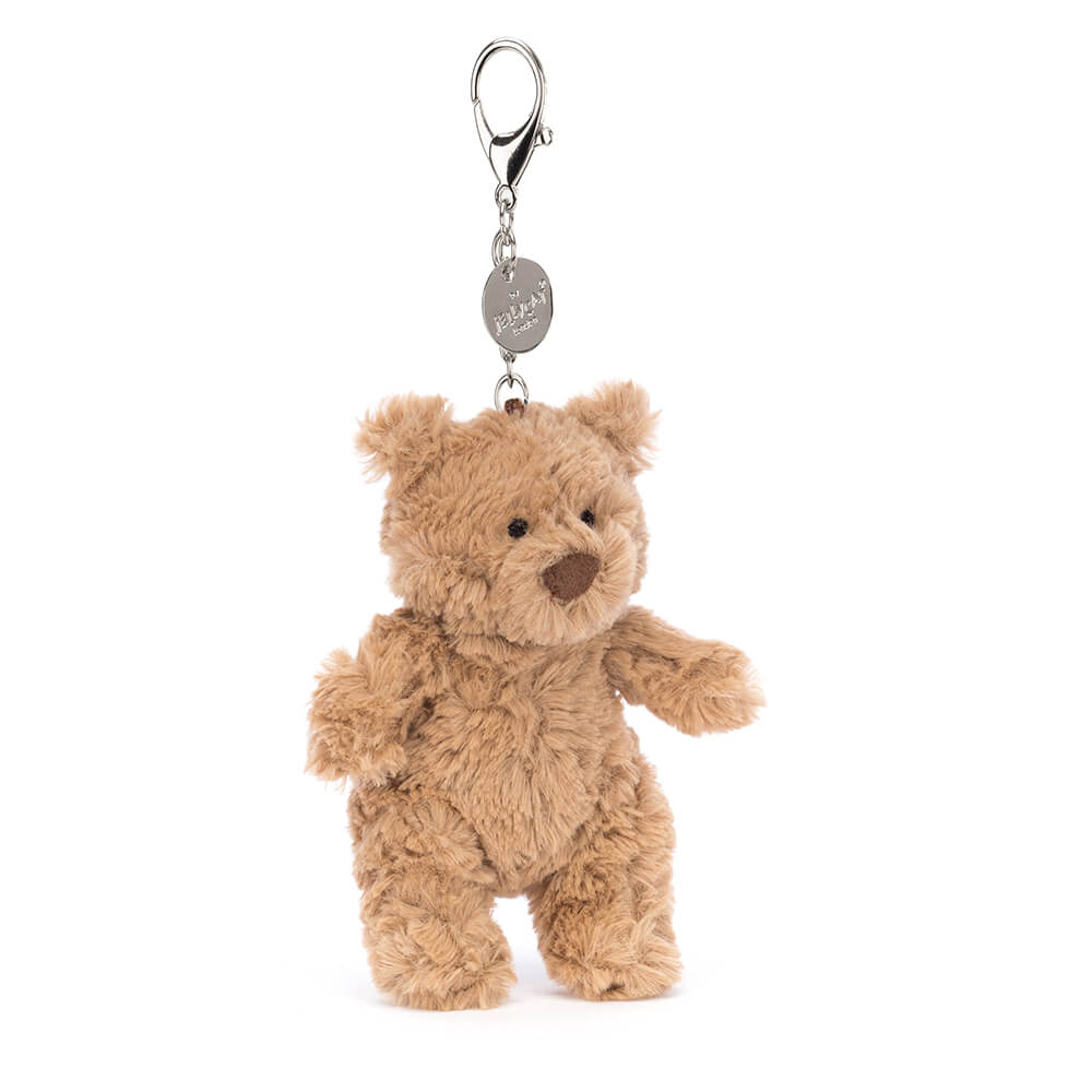Jellycat Bartholomew Bear bag charm standing with silver clasp on white background