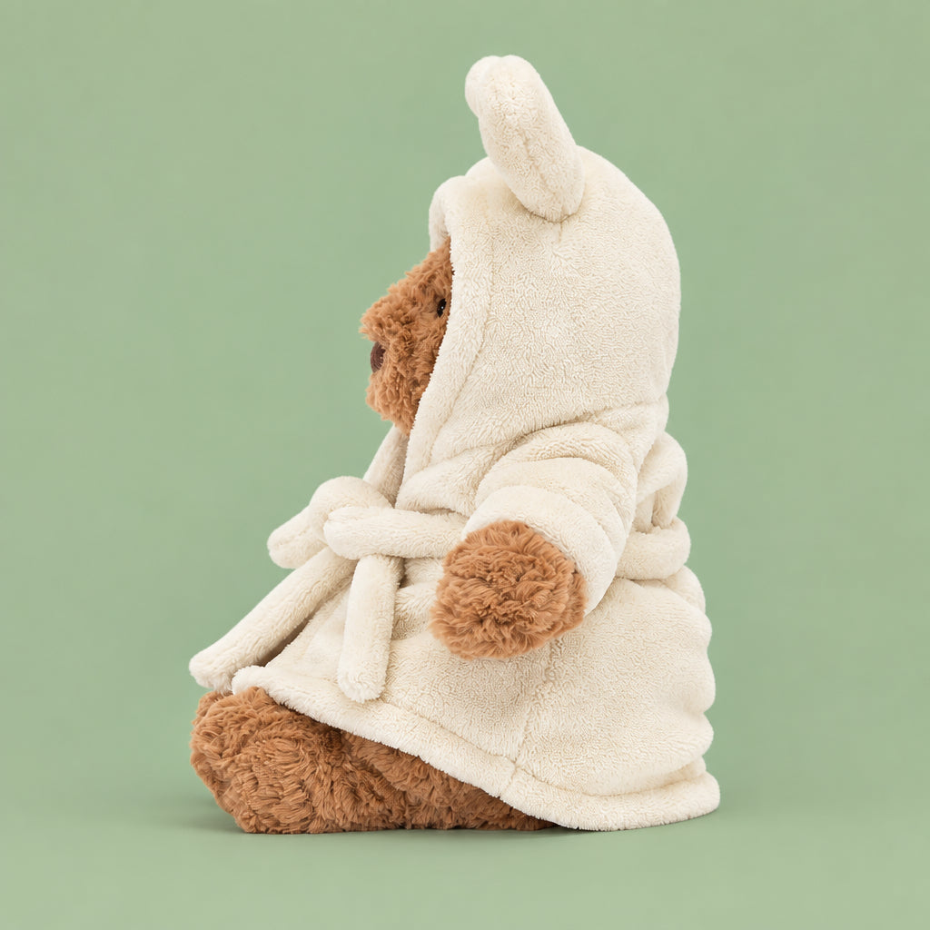 A side view of Jellycat Bartholomew Bear Bathrobe.