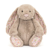 Front view of Jellycat Blossom Beige Bunny ‘Petal’ with floppy floral ears, a gentle smile, and detailed plush design.