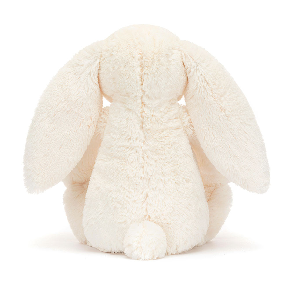 Back view of Jellycat Blossom Cream Bunny ‘Berry’, featuring the soft fabric and fluffy tail.