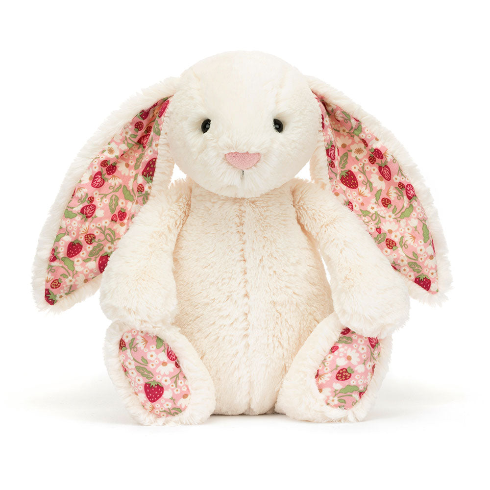 Front view of Jellycat Blossom Cream Bunny ‘Berry’, showcasing its soft cream fur and floral-patterned ears.