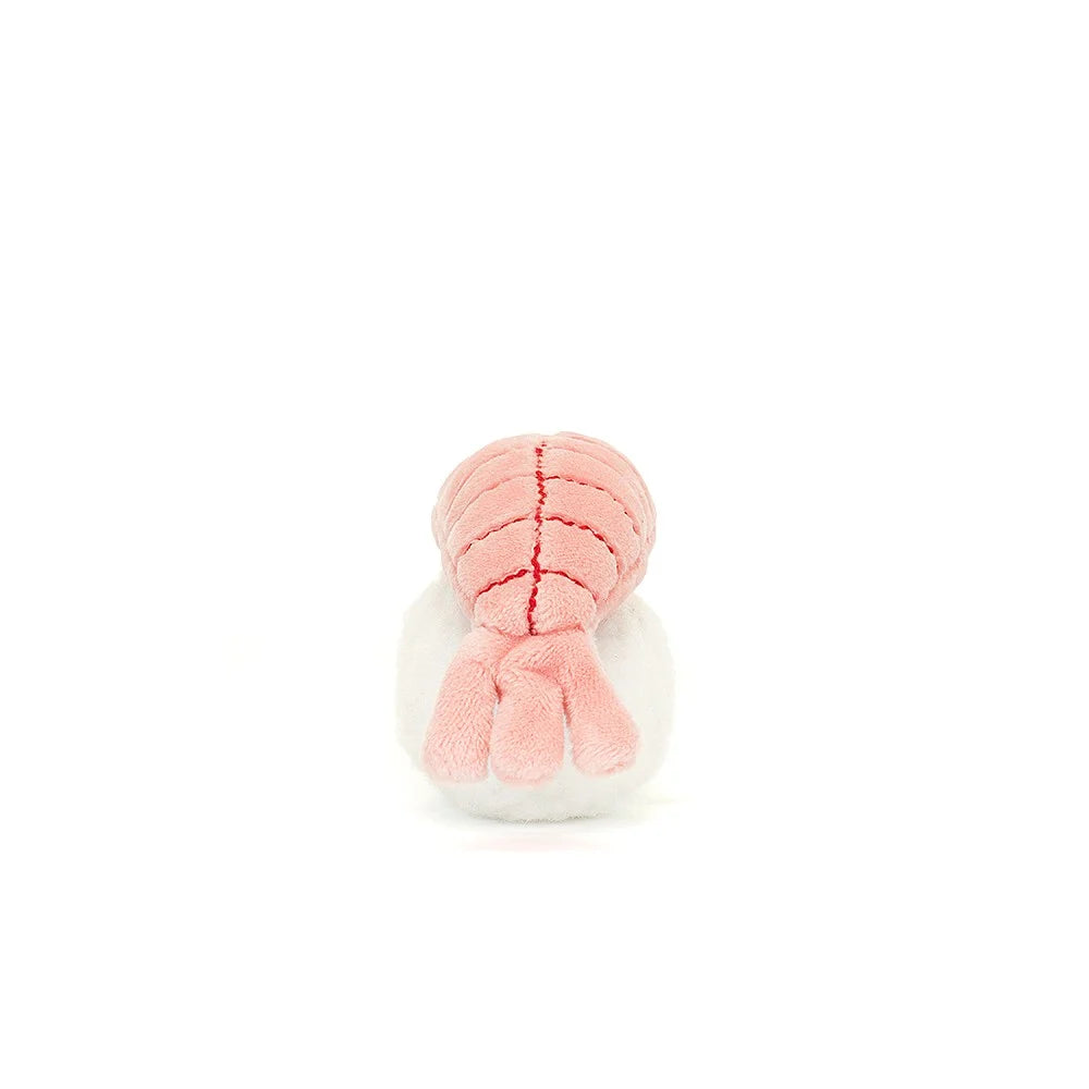 Side view: Don't miss the tail! Sassy Sushi Nigiri by Jellycat shows off its playful side with a pink shrimp hat and stitched details, perched on a bed of soft rice.