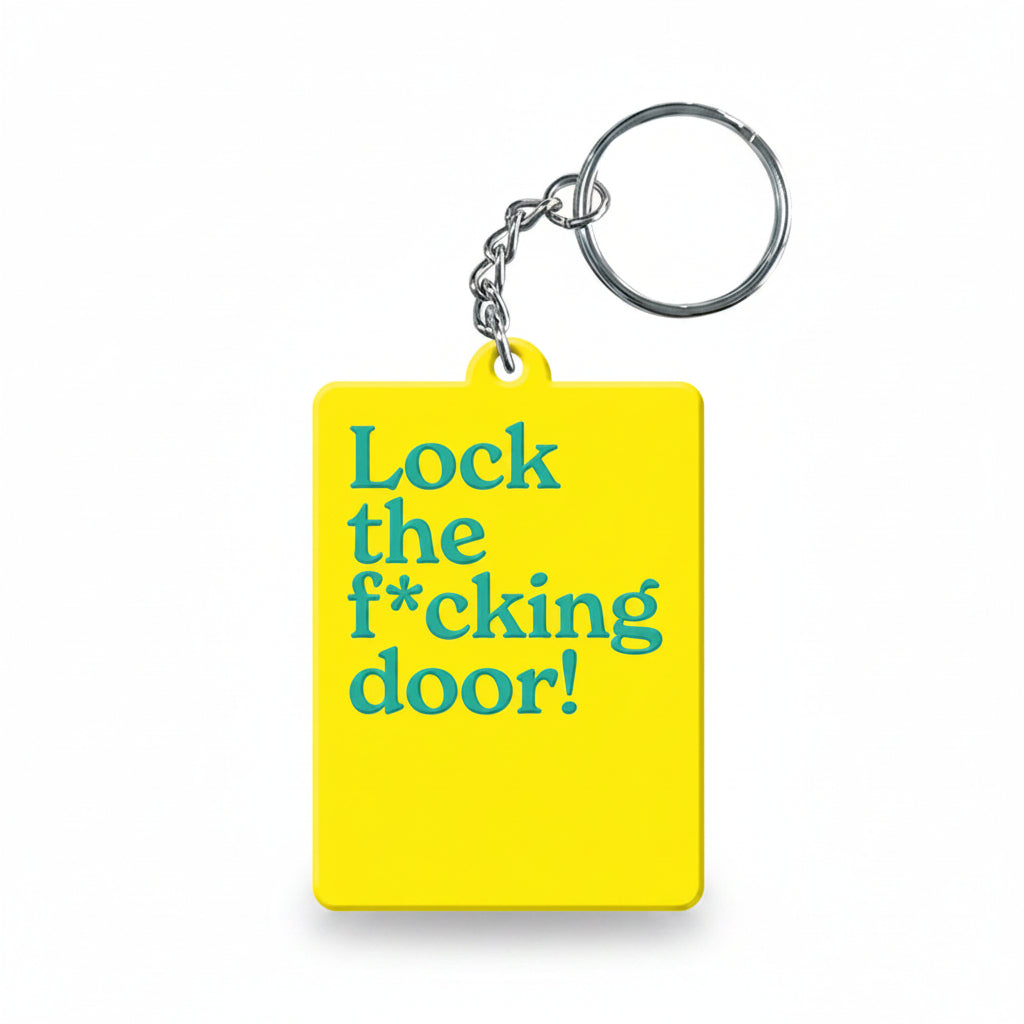 Yellow 'Lock the f*cking door' keyring with silver split ring on white background