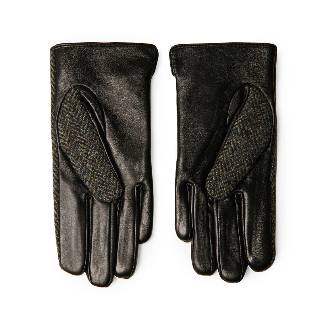 Close-up of Harris Tweed® label on black and grey herringbone ladies gloves.