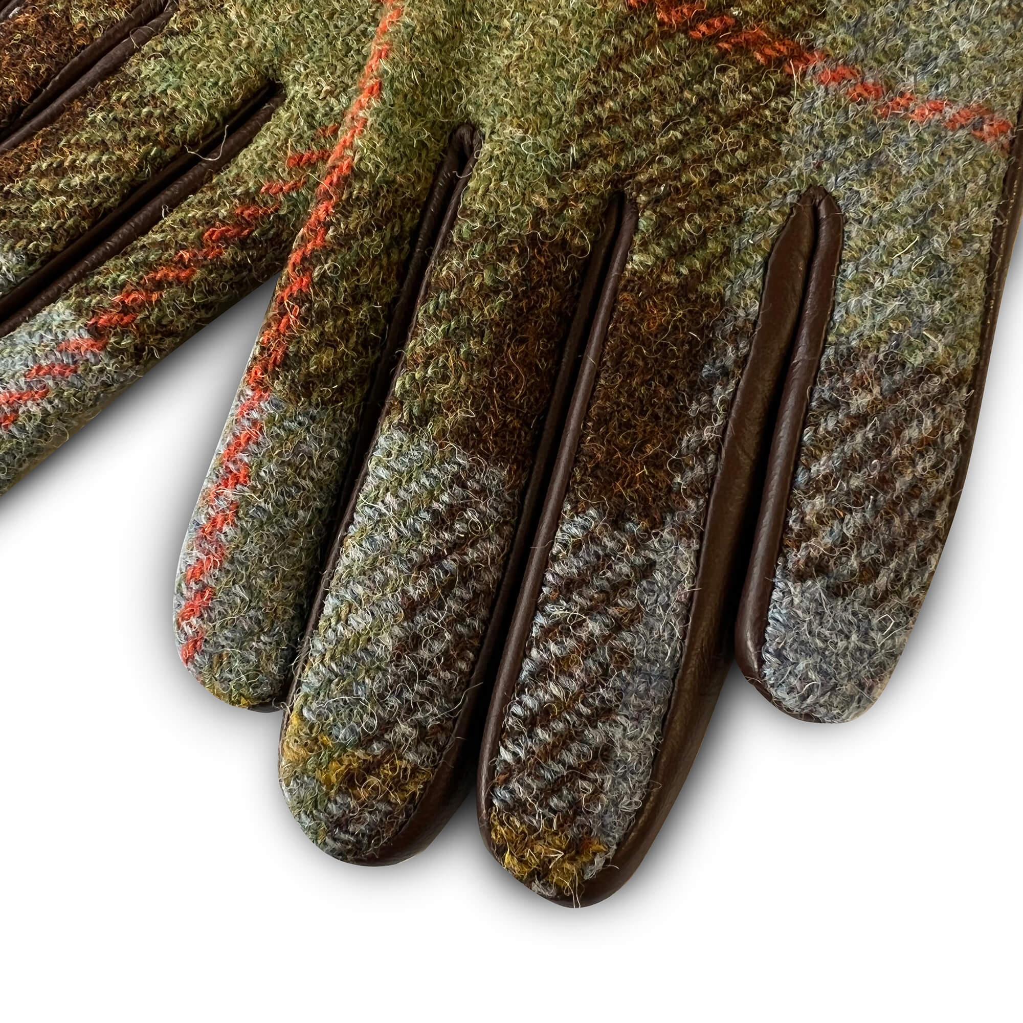 Close-up of glove fingers in green, blue and rust Harris Tweed®, showing fine wool texture and brown leather accents.