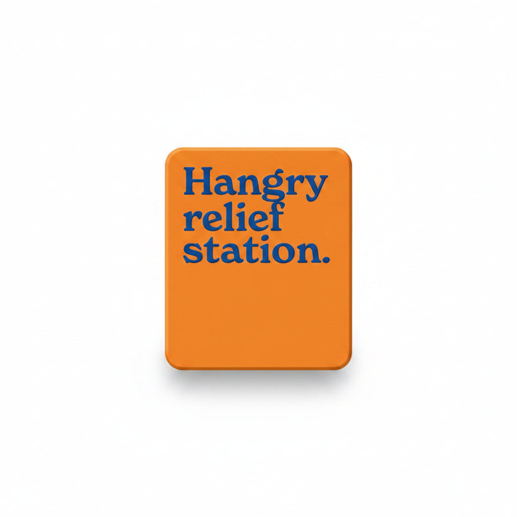 Orange fridge magnet reading hangry relief station