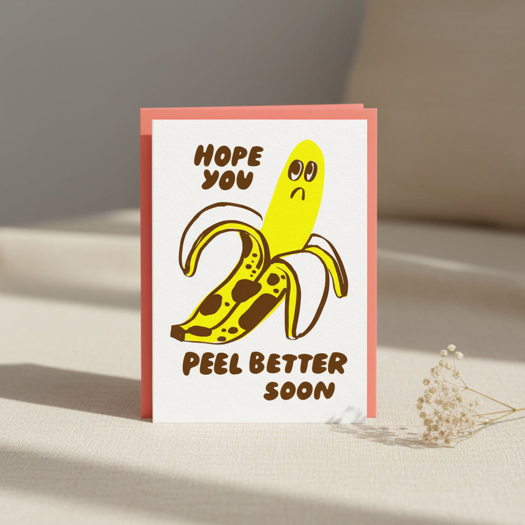 Card with a cartoon banana character and text 'Hope you peel better soon' on a white background.