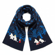 Moomin Blue Forest Embroidered Scarf featuring Moomin characters walking through a blue forest, displayed on a pink background.