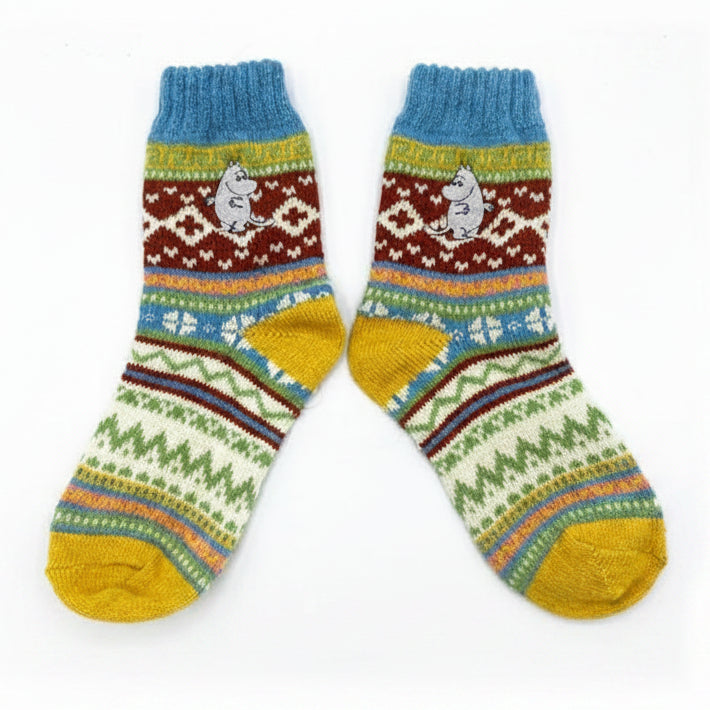 Pair of Moomin Fair Isle socks displayed flat with Moomin embroidery and colourful winter pattern.