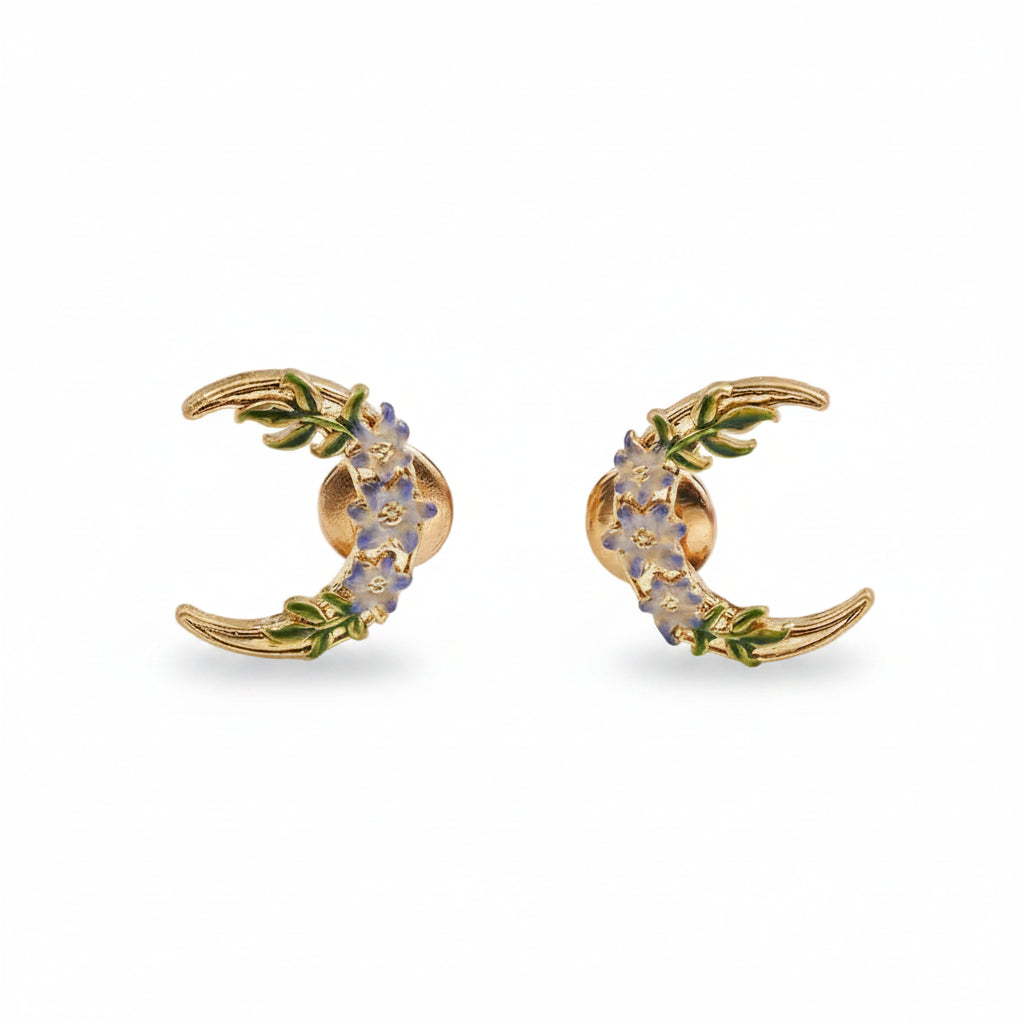 Nightshade Moon gold stud earrings with violet enamel flowers.