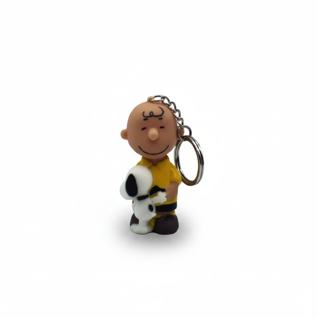 Full front view of Charlie Brown hugging Snoopy keyring against a white background.