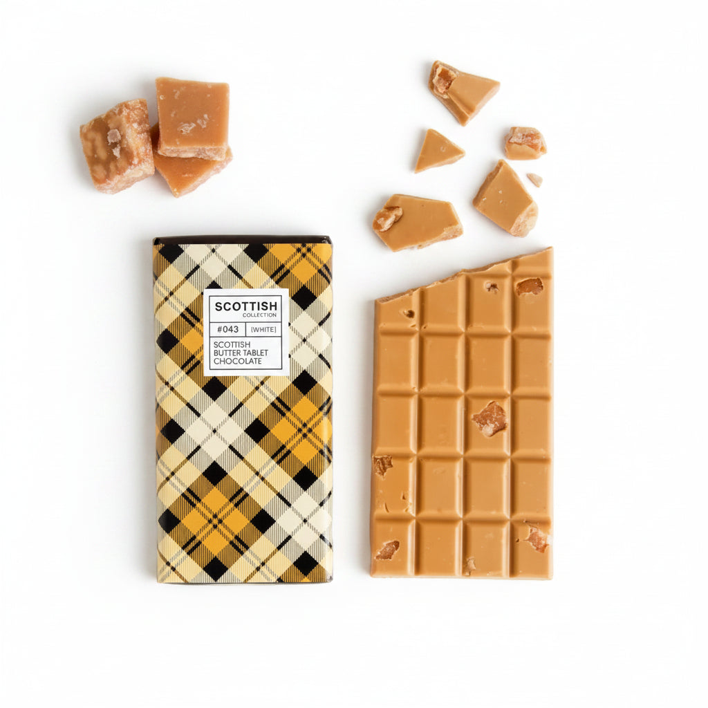 Handmade Scottish Tablet Chocolate Bar with creamy gold and white chocolate, studded with authentic butter tablet pieces and wrapped in a yellow tartan design.