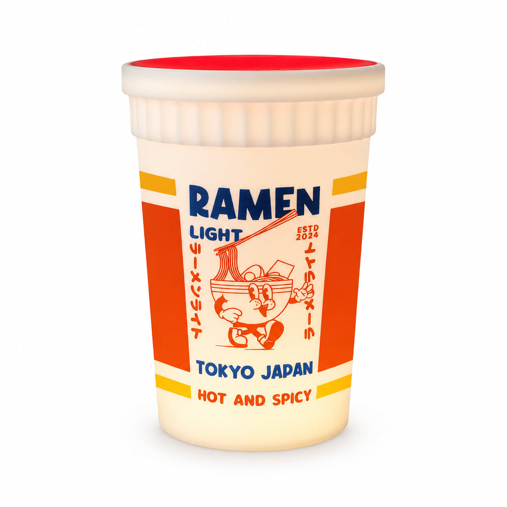 Side profile of the glowing Ramen Light lamp showing its red lid and vibrant orange panel design.