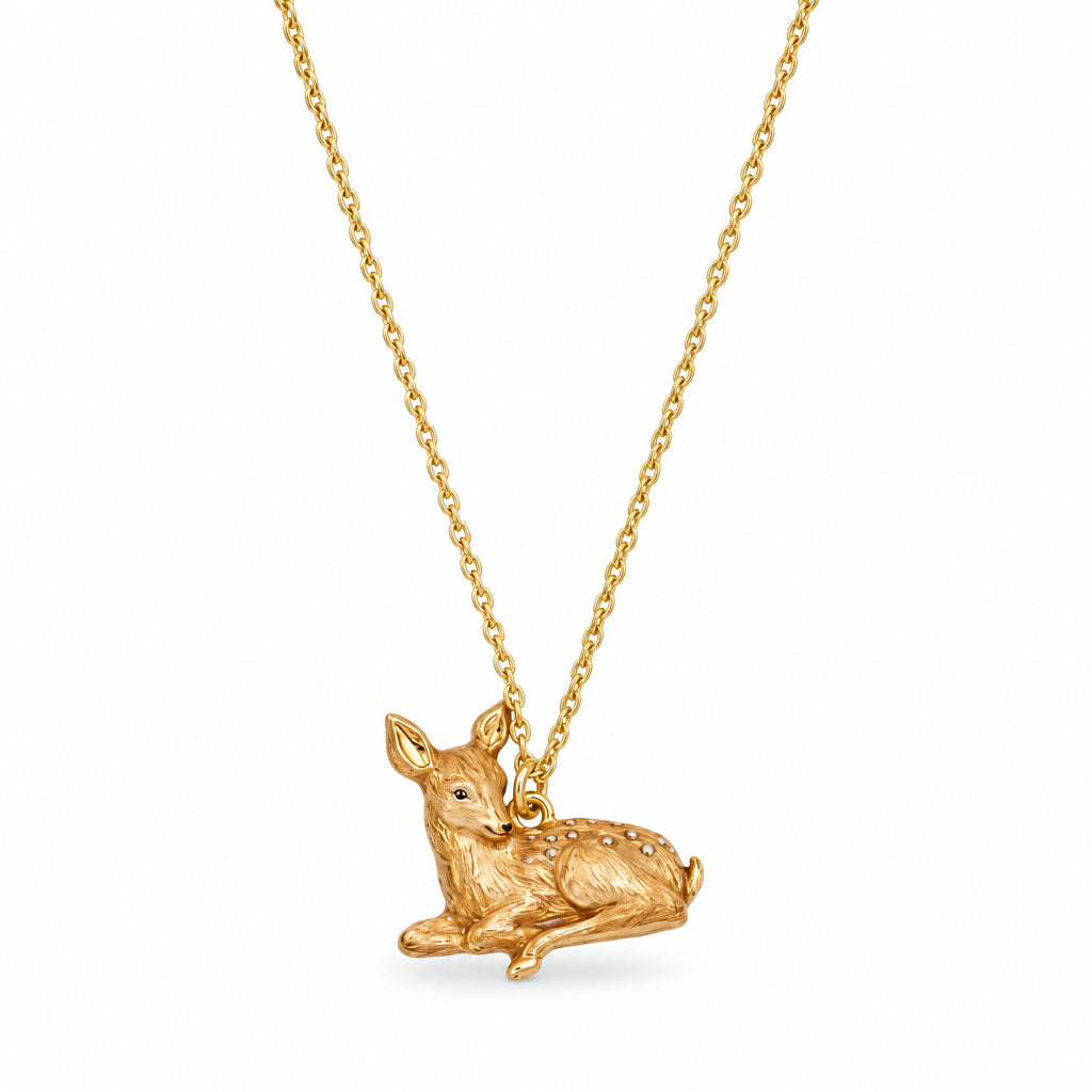 Resting Fawn Gold Chain Necklace pendant close-up on white background.