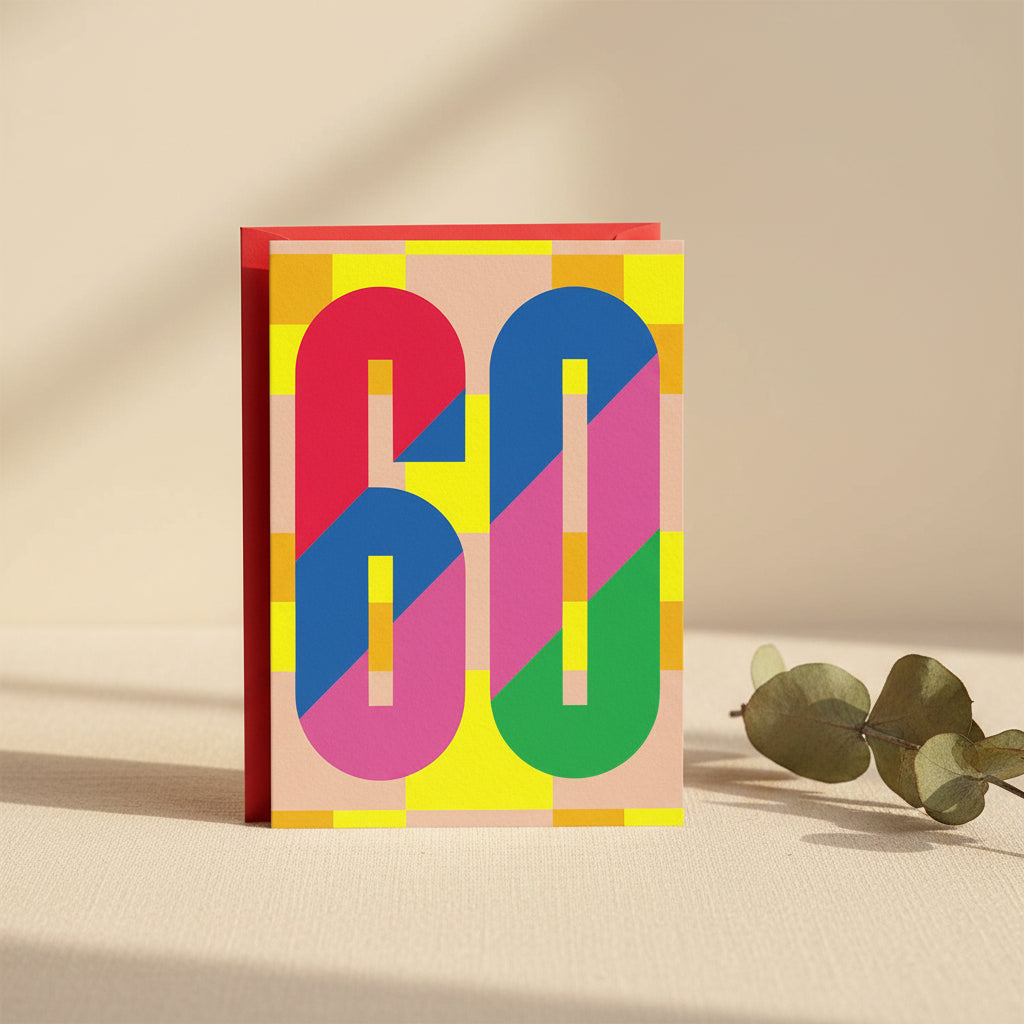 60th birthday card with multicoloured numerals on checks and red envelope