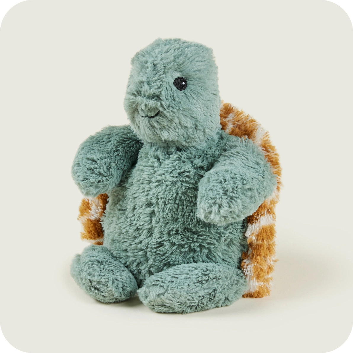 Warmies Baby Turtle side angle showing green plush body and patterned shell.