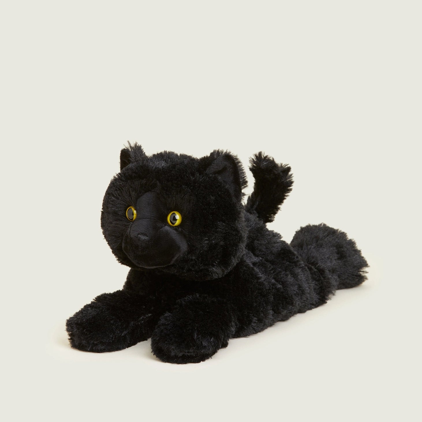 Front angled view of Warmies Black Cat lavender-scented heatable soft toy showing its fluffy texture and cute face.