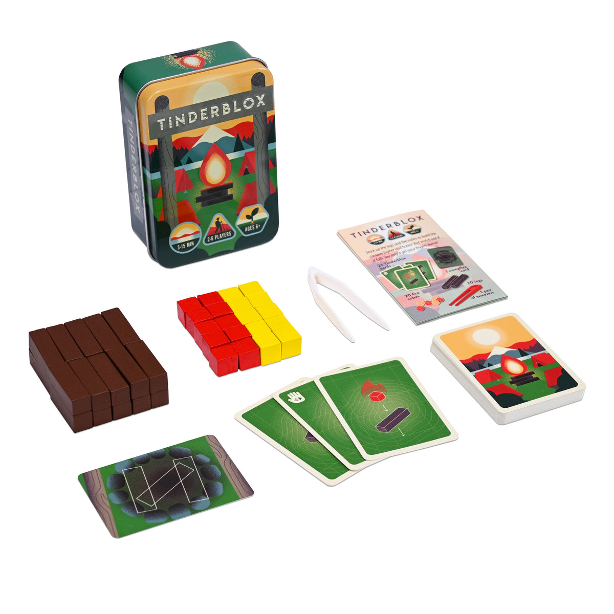 Tinderblox tin, tweezers, logs, cubes and cards laid out on white