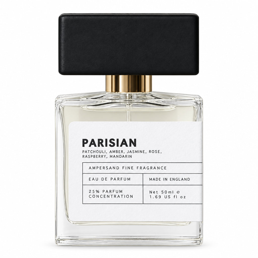 Parisian eau de parfum bottle with black cap, front view on cream background