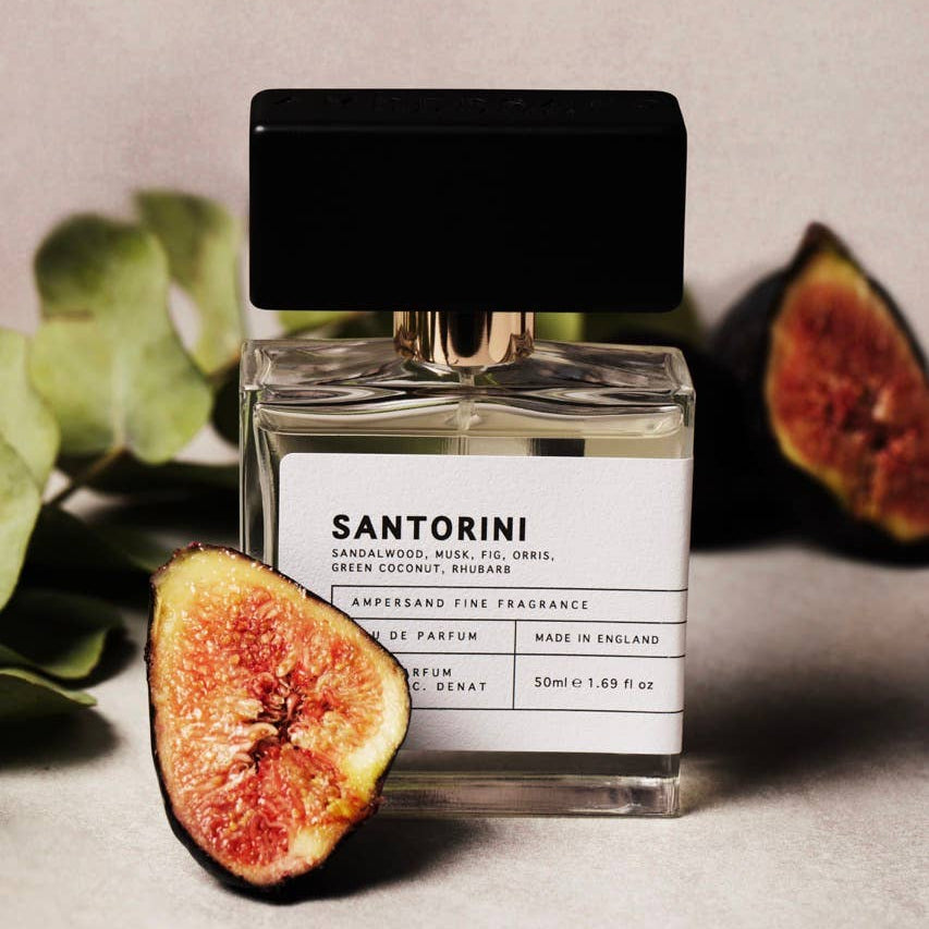 Santorini eau de parfum styled with fresh fig halves and fig leaves